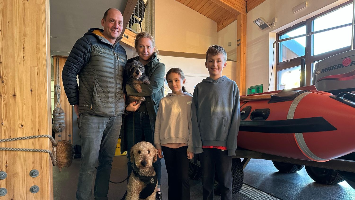 Olive the Airdale Terrier with her family