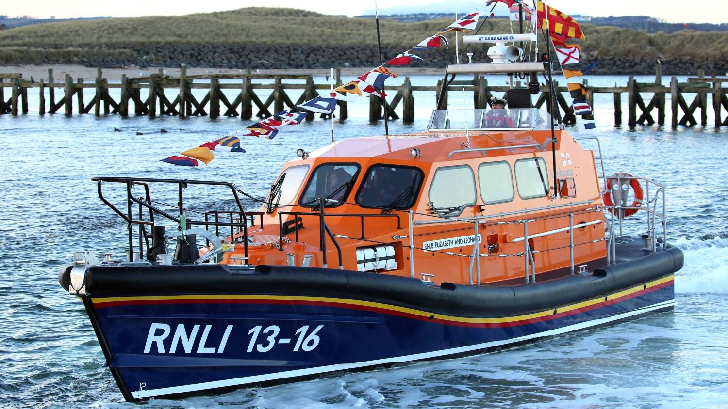 A Shannon class all weather lifeboat decorated with flag bunting.