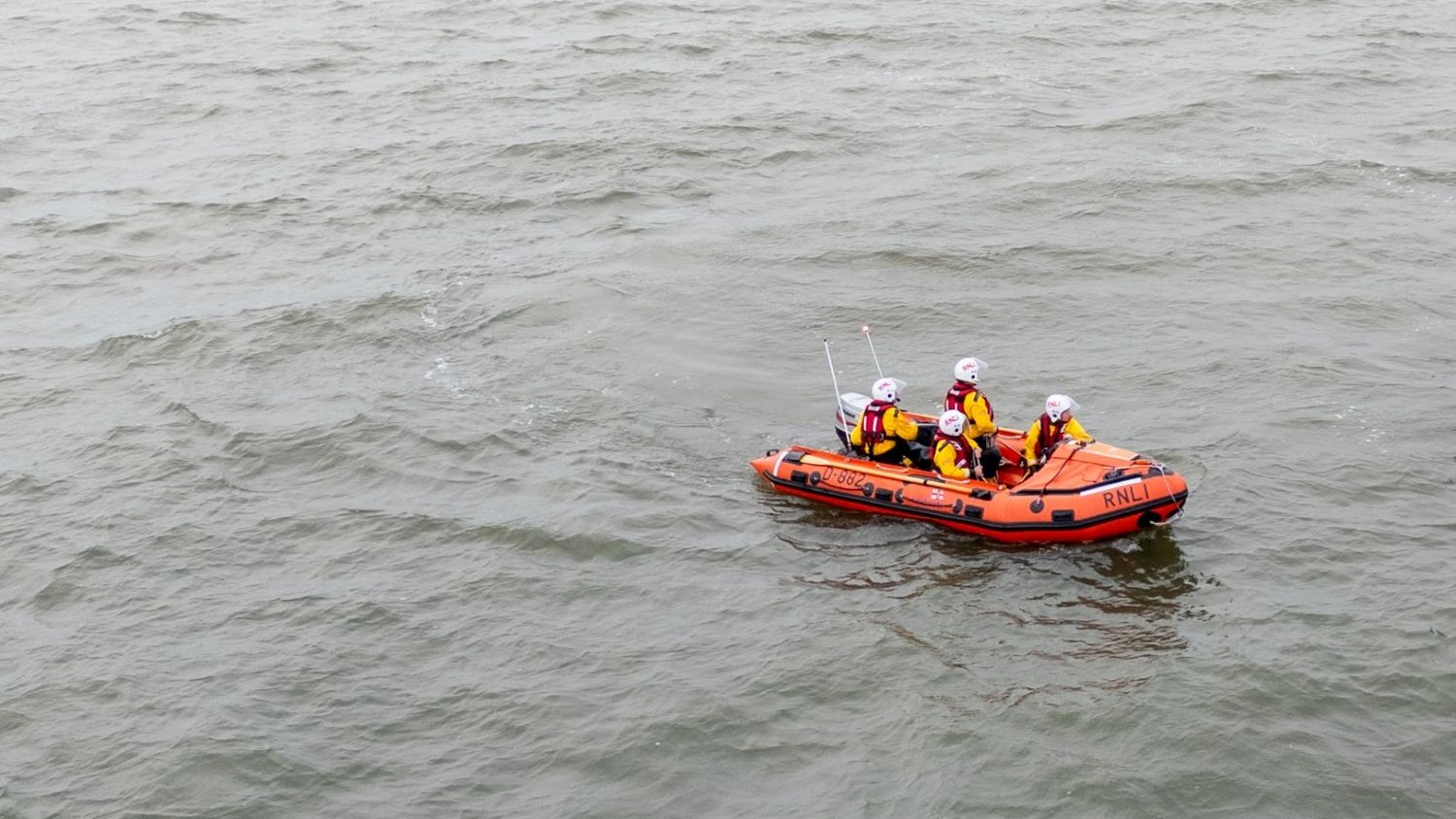 A small rib with four crew on board.