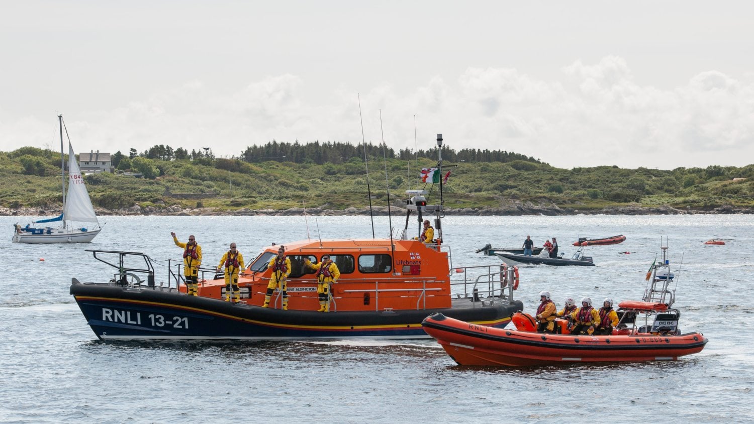 Clifden lifeboat crew waving from their two lifeboats 