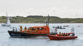 Clifden lifeboat crew waving from their two lifeboats 