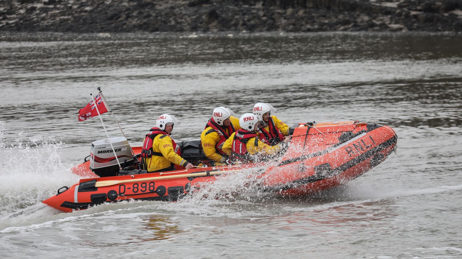 Conwy D-class inshore lifeboat Enid and John Hislop D-898 at sea during a launch and recovery training exercise.