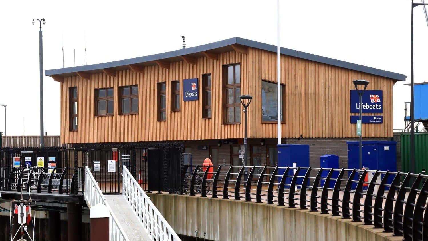 A two-storey wooden building with a sloping roof.