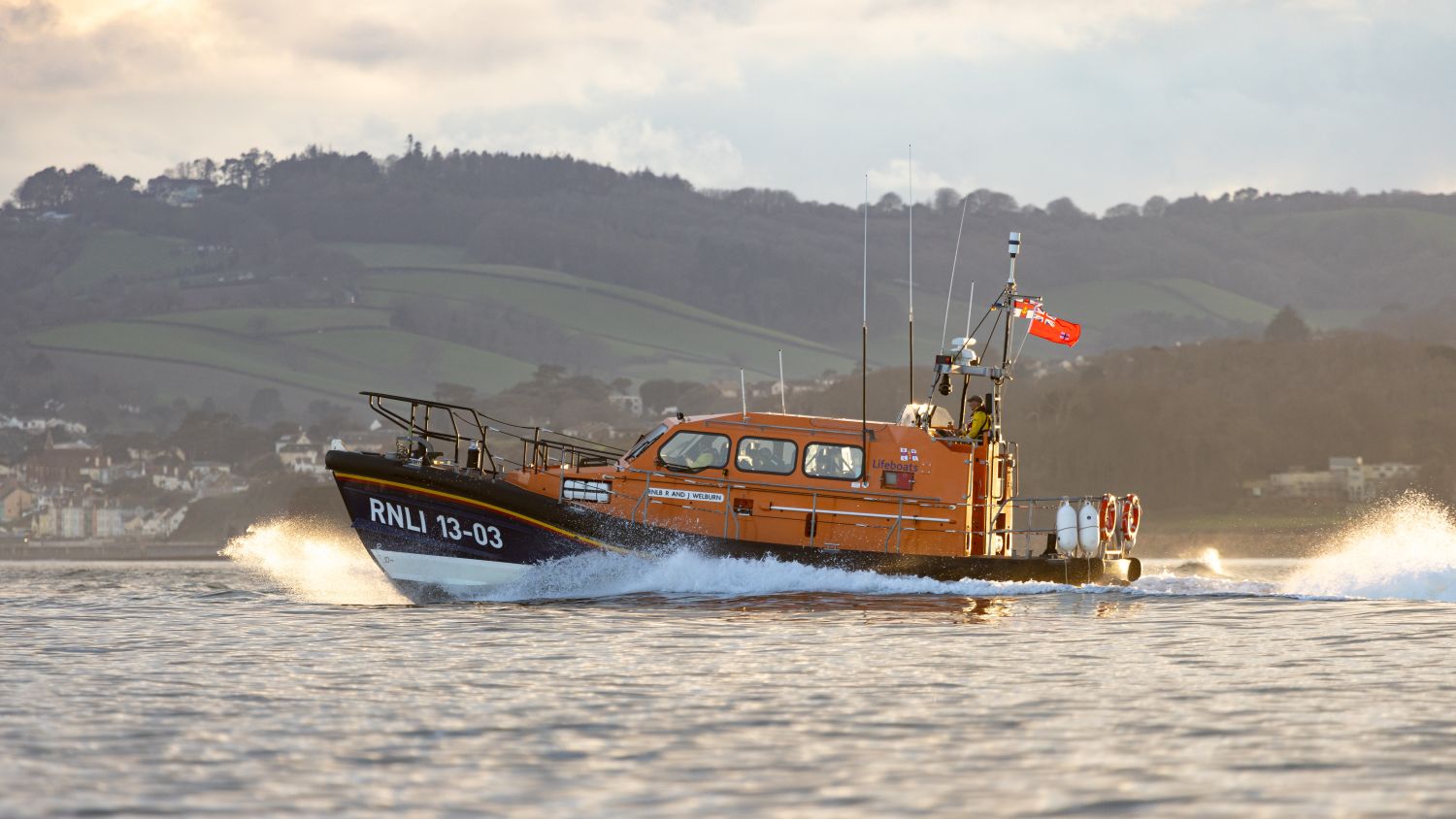 Launch and recovery exercise of Exmouth Shannon class lifeboat R and J Welburn 13-03 at sunset