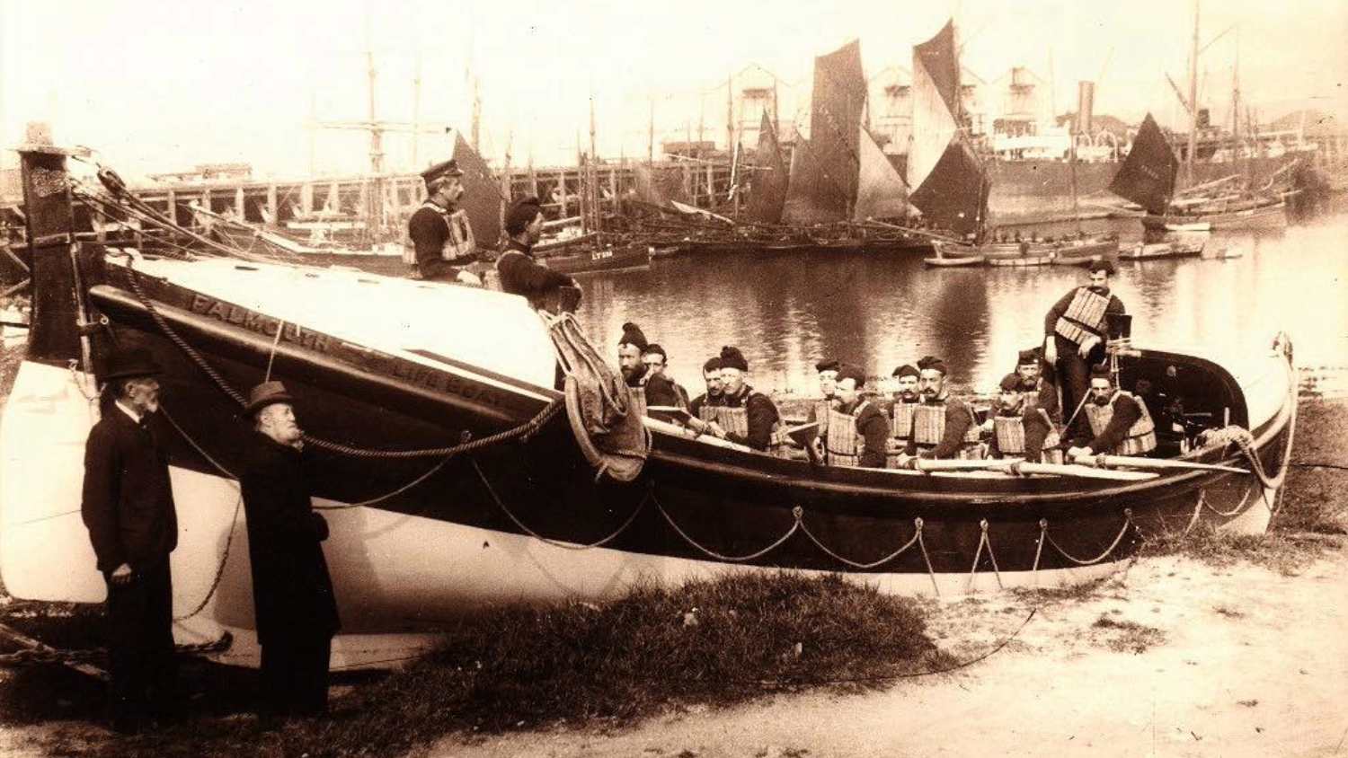 Scanned photo of lifeboat 'The Bob Newton' shore-beached with crew aboard