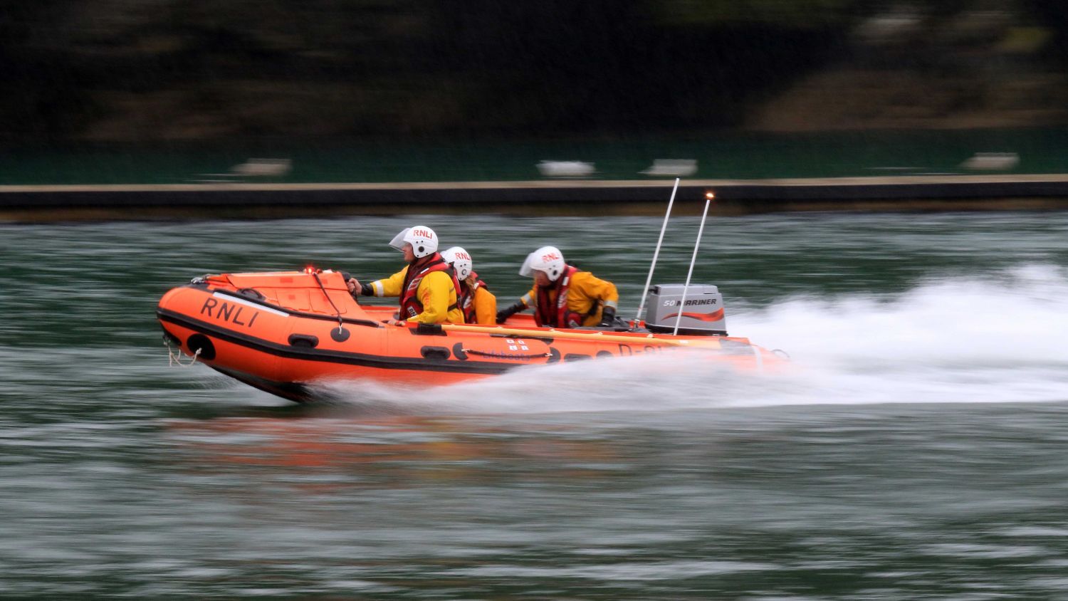 D class lifeboat Olive Three moving at speed through the water at Fowey