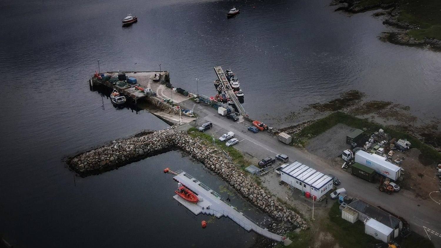 An aerial view of Leverburgh Lifeboat Station with their B class lifeboat on its floating pontoon