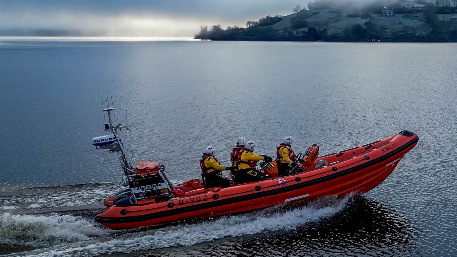 The Loch Ness lifeboat on calm water.