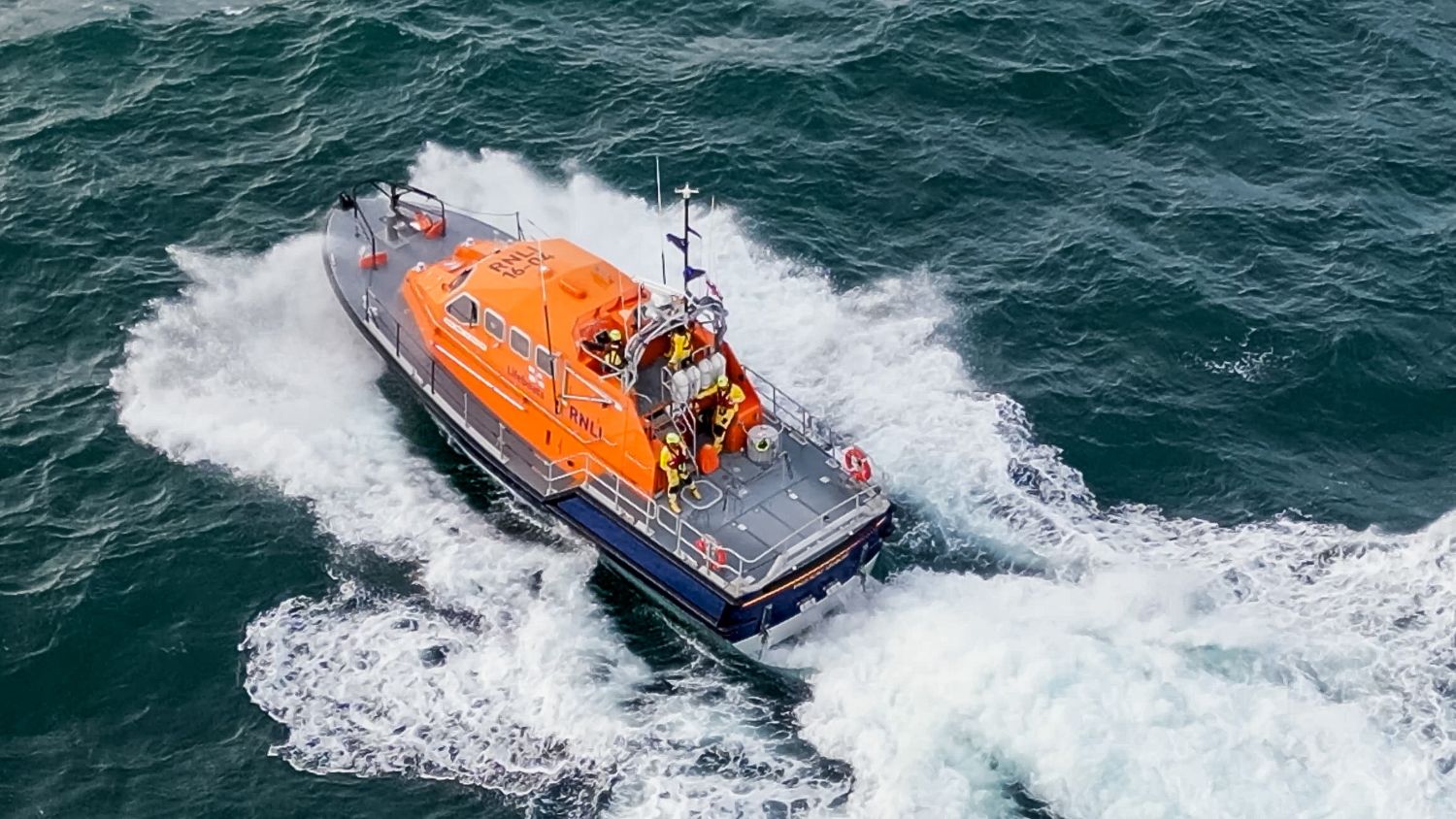 Aerial drone shot of Padstow Tamar class lifeboat Spirit of Padstow 16-04 at sea.