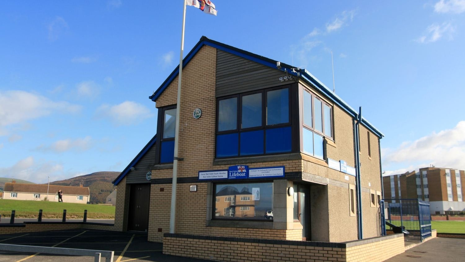 A two-storey yellow brick building.