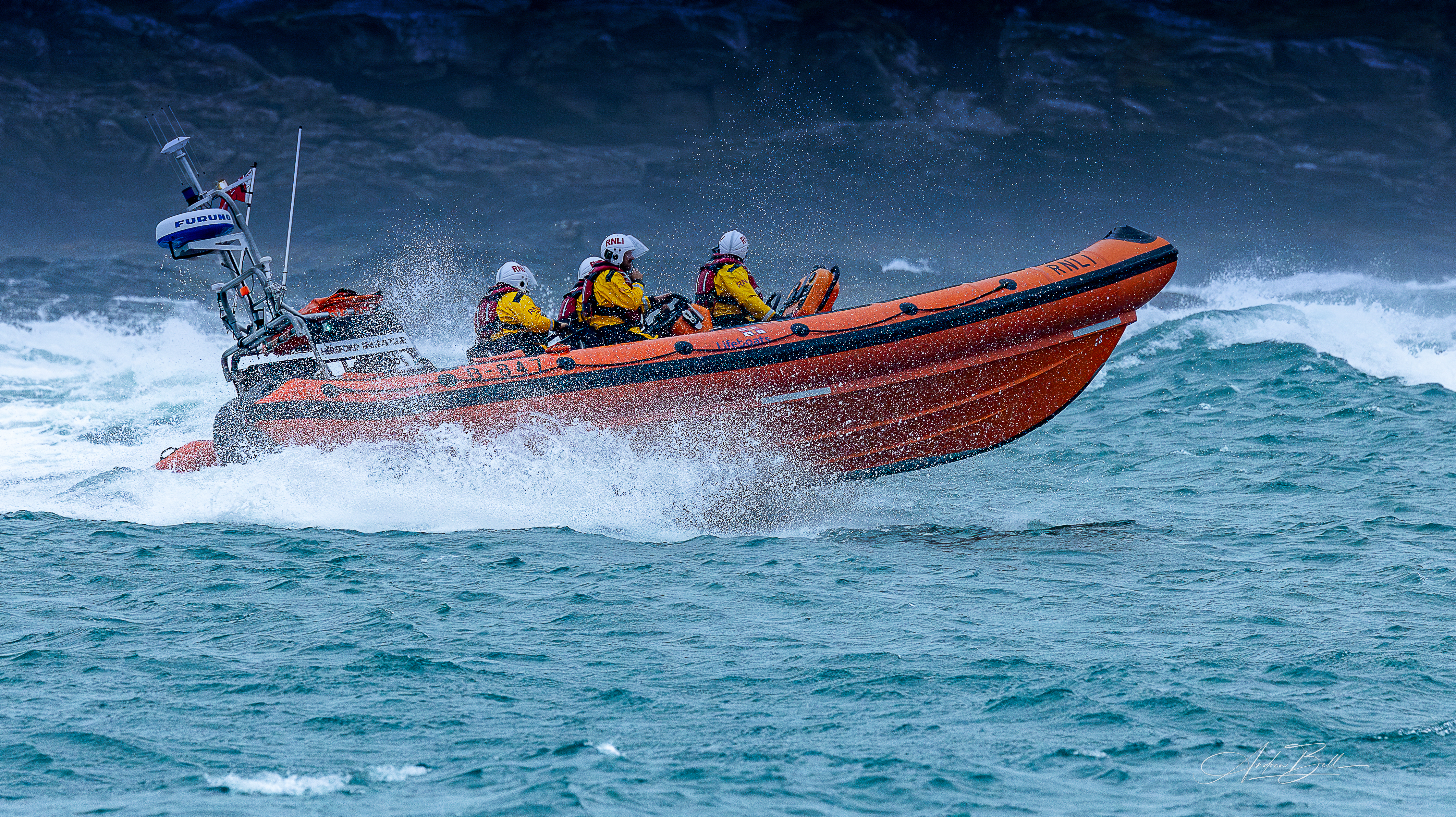 Trearddur Bay Atlantic 85 inshore lifeboat Hereford Endeavour B-847 at sea. Rough conditions, big waves, white spray.