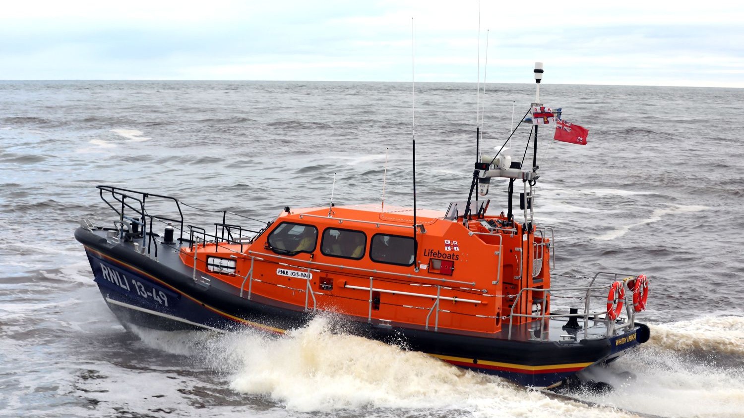 The Whitby all weather lifeboat creating a wake.
