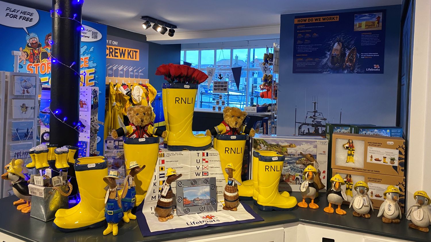 Items for sale displayed on shop counter in the RNLI Weymouth Shop