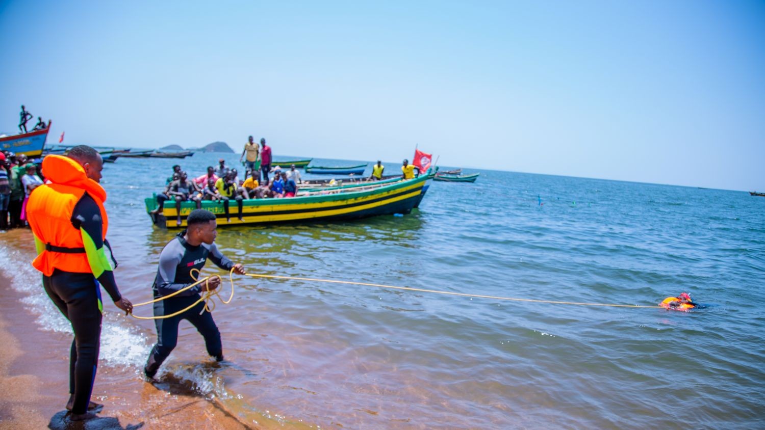Man saving someone in the sea.