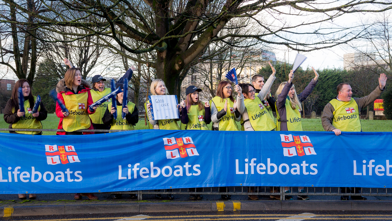 RNLI volunteers cheering on the runners