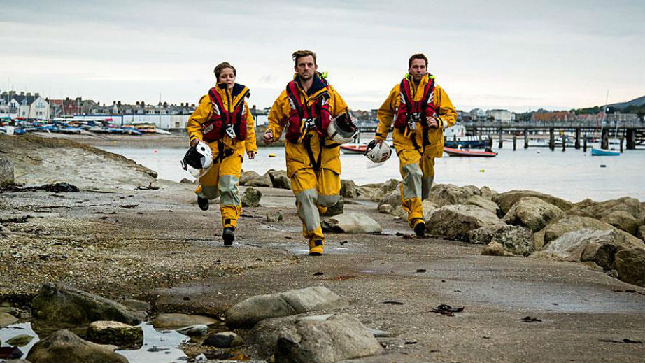 Swanage RNLI lifeboat volunteer crew running to shout