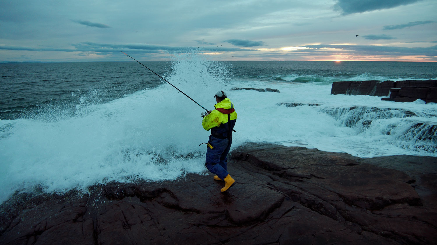 Rock angler at sunset