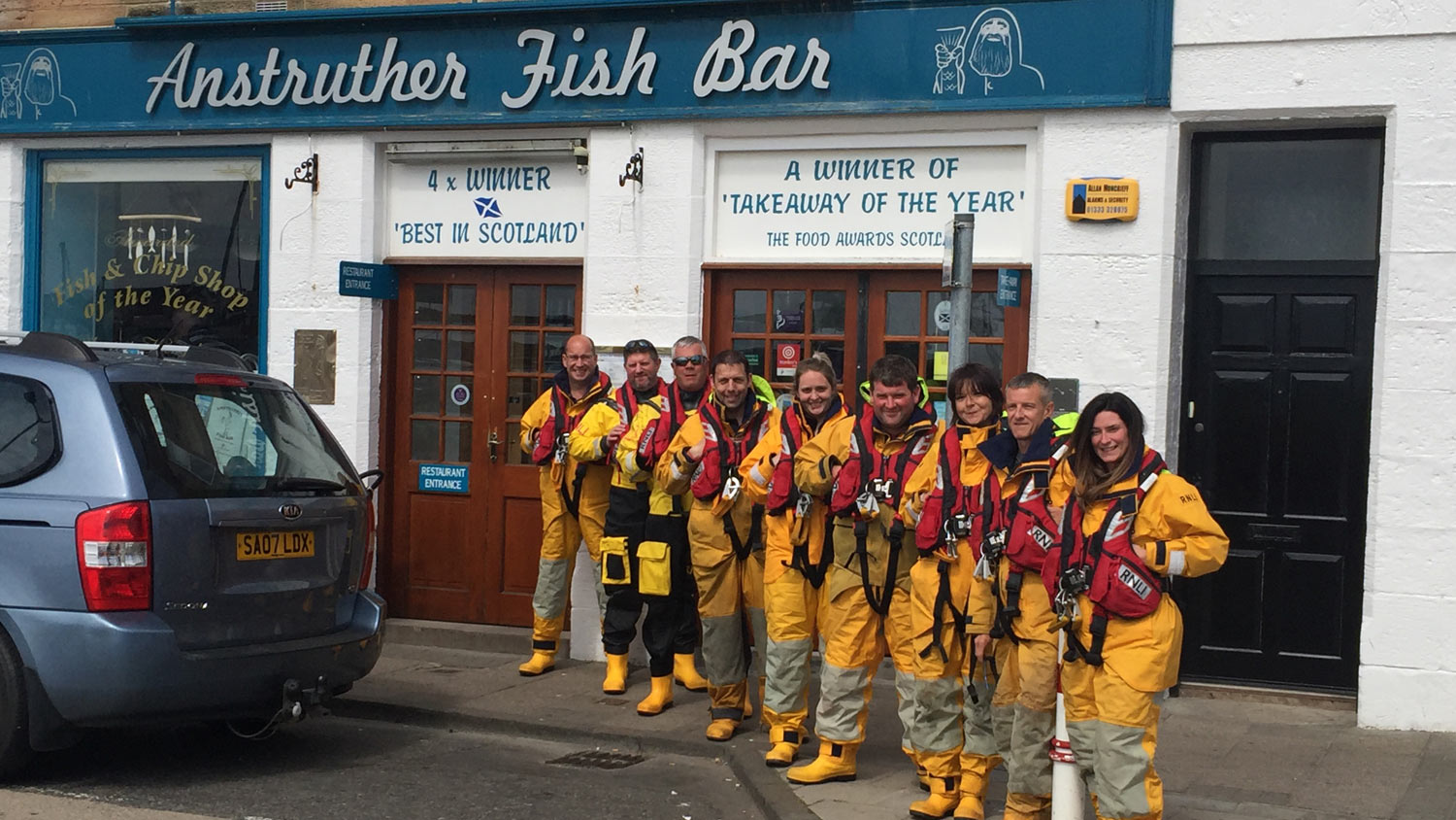 Anstruther lifeboat crew outside the Anstruther Fish Bar
