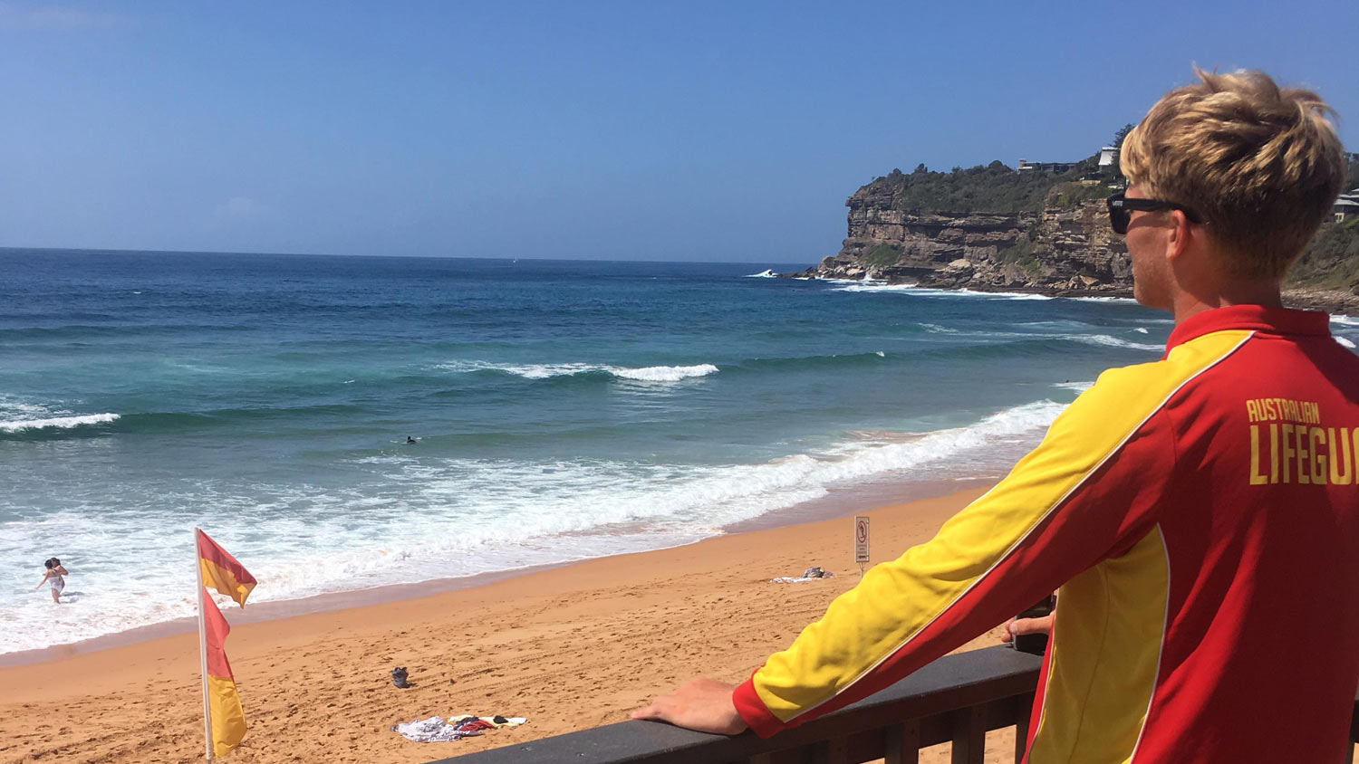 RNLI Lifeguard Ben Le Clerq looks out to sea while on duty in Australia