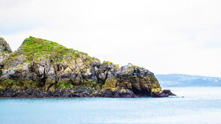 The darker area on the rocks shows where the tide comes up to