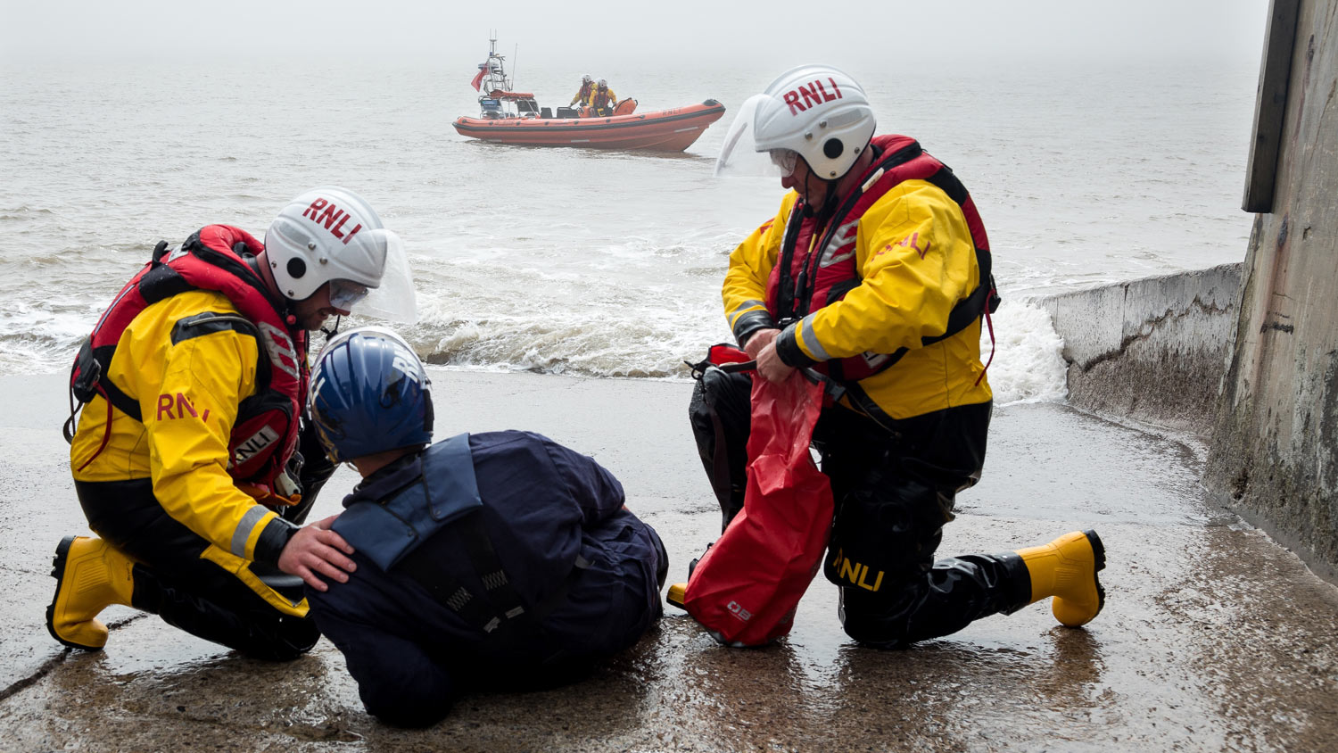 A 'casualty' is assisted after being found by a drone in a test