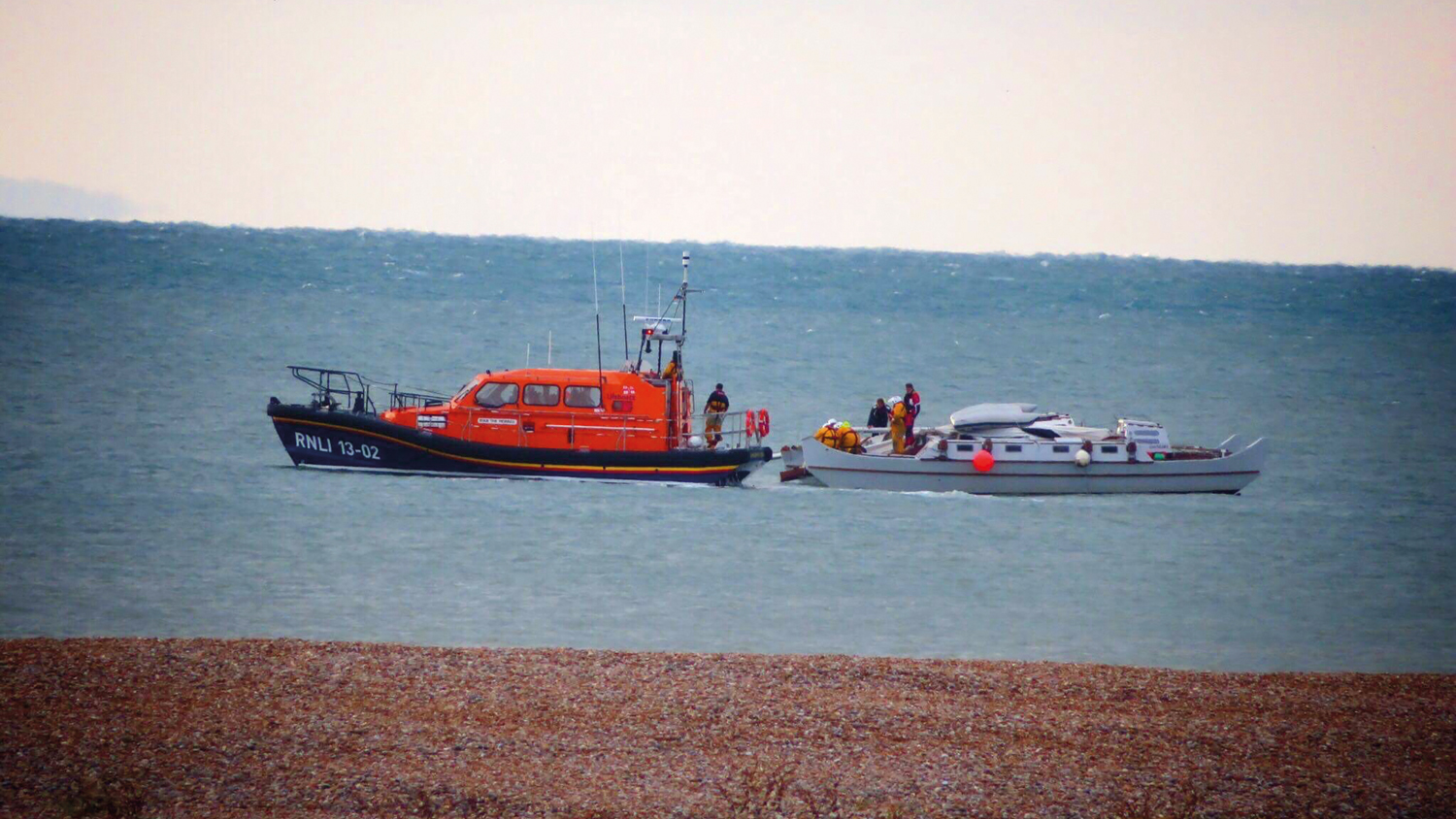 Dungeness's Shannon class lifeboat helps a catamaran in the English Channel