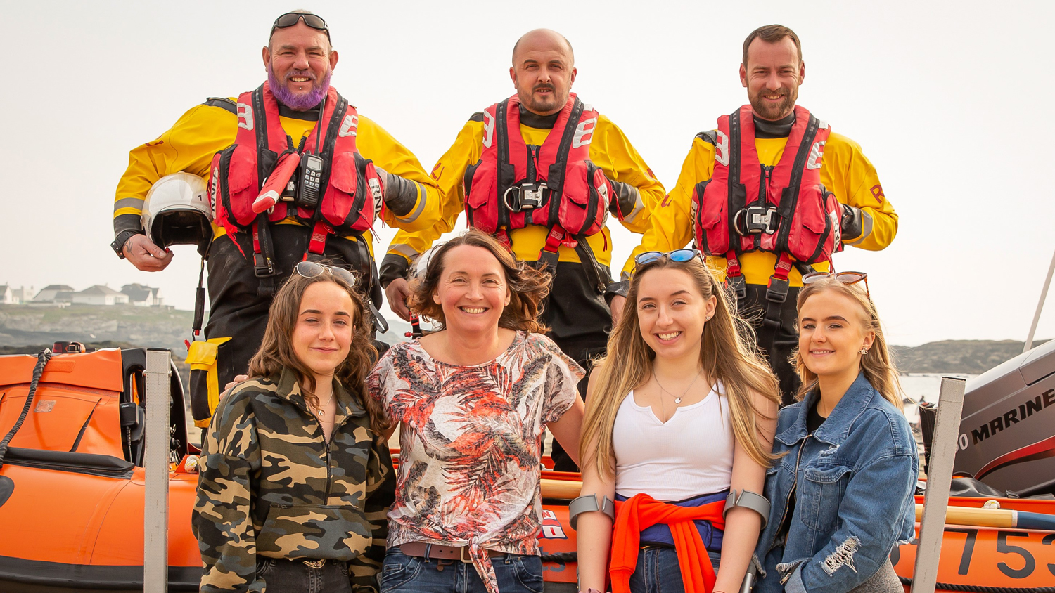 Kayakers Katie, Julie, Megan and Rachel with three of their Trearddur Bay RNLI rescuers - Helm Daf Griffiths and Crew Members Steve Williams and Tom Kearney