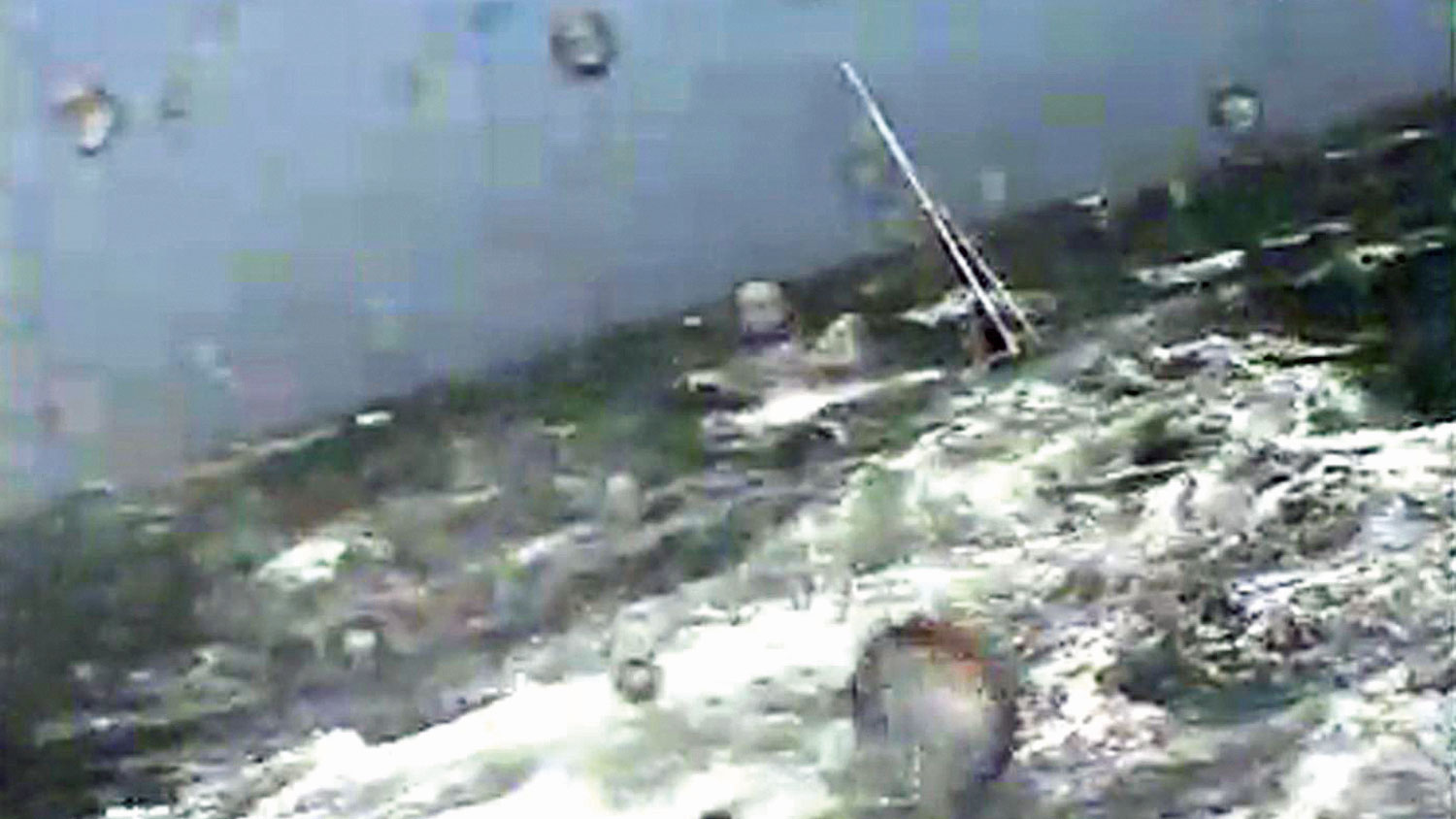 Still from Rosslare Harbour RNLI rescue footage showing the yacht being towed