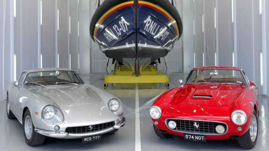 The two ferraris left to the RNLI as a gift in a will parked up next to a Shannon class lifeboat.