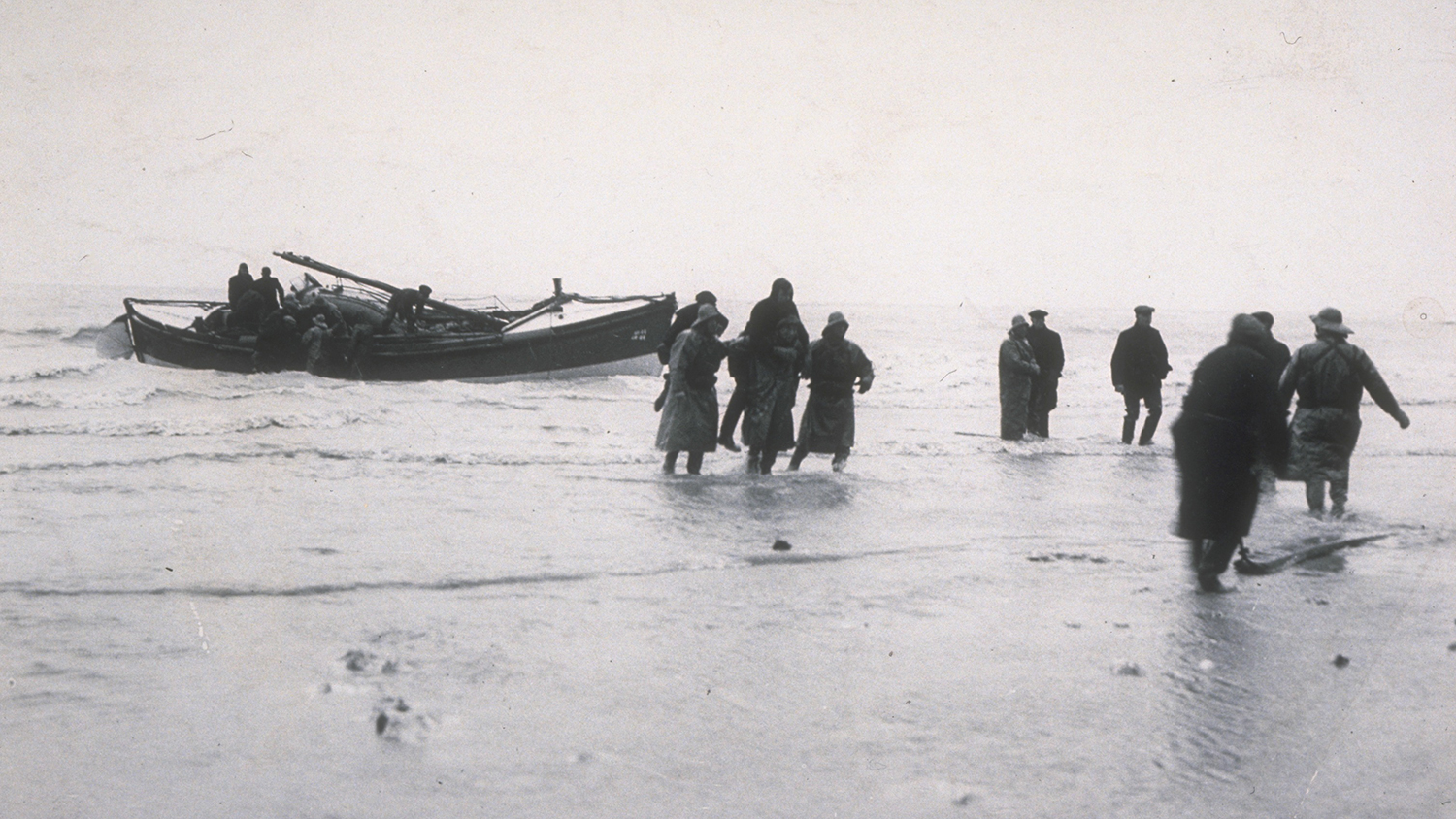 1940: Sheringham lifeboat crew landing the crew of the bombed SS Boston Trader