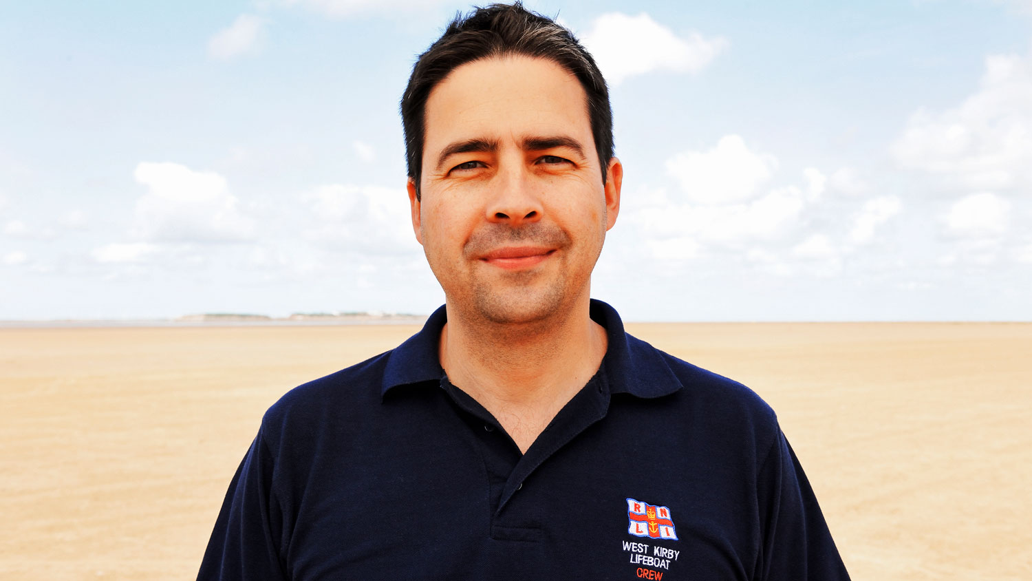 Portrait shot of West Kirby Crew Member Adie Gregan on the beach