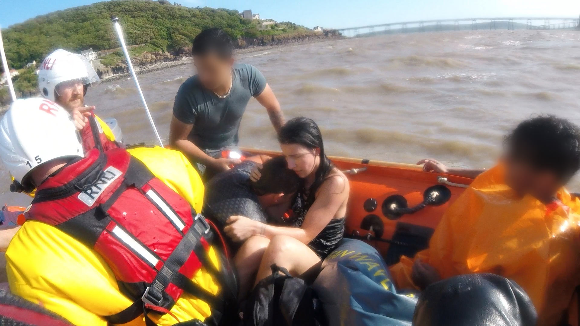The two rescued casualties embrace
