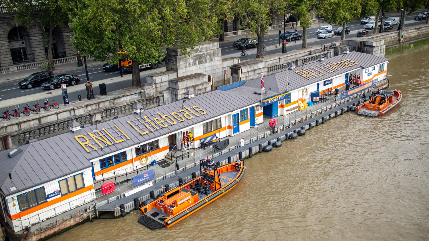 View of Tower Lifeboat Station on the River Thames in Central London from Waterloo Bridge