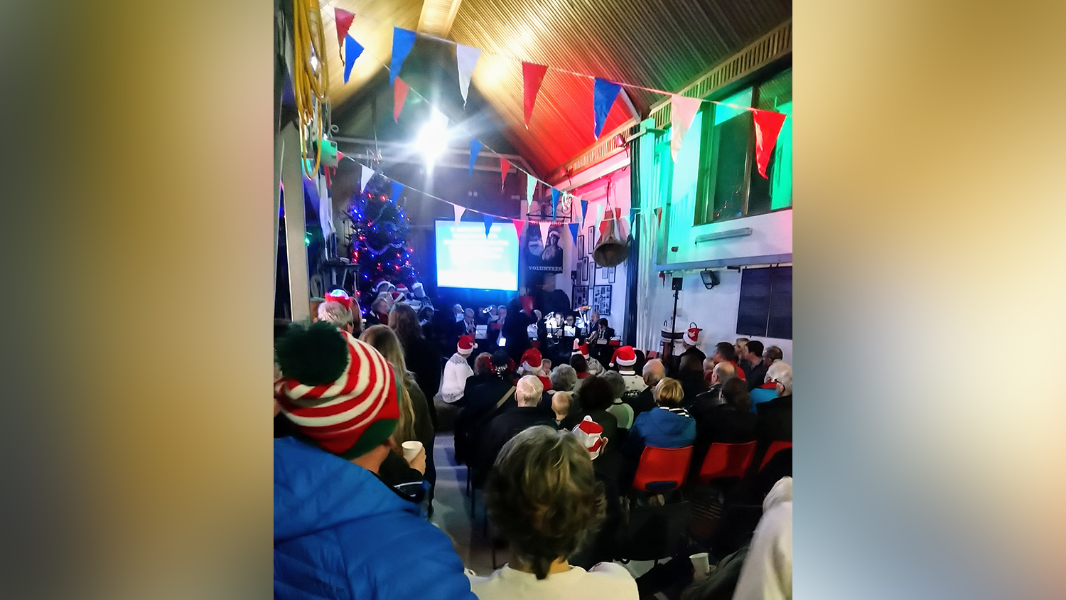 Families gather for a Christmas carol service at Exmouth Lifeboat Station 