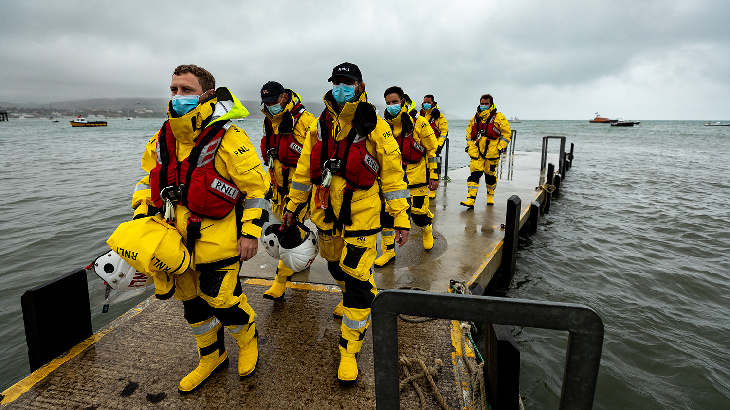 Swanage crew members coming back after a shout, wearing face masks