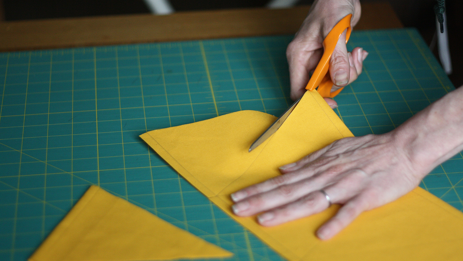 Cut out the triangles and press them with an iron