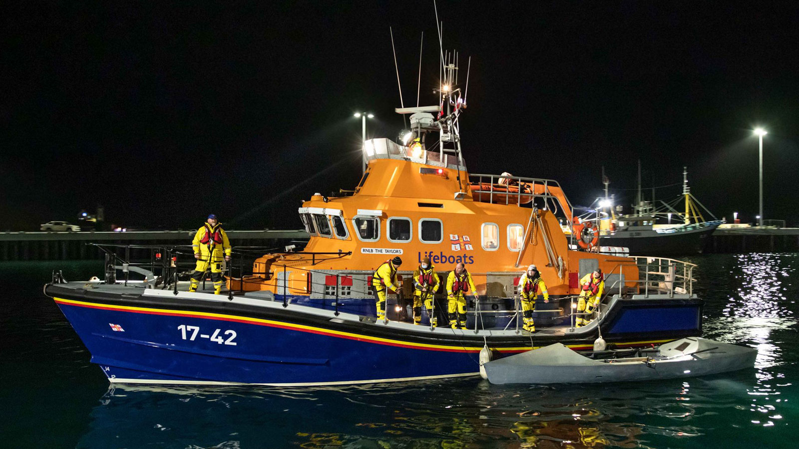 Thurso Severn class lifeboat next to sea kayak they rescued