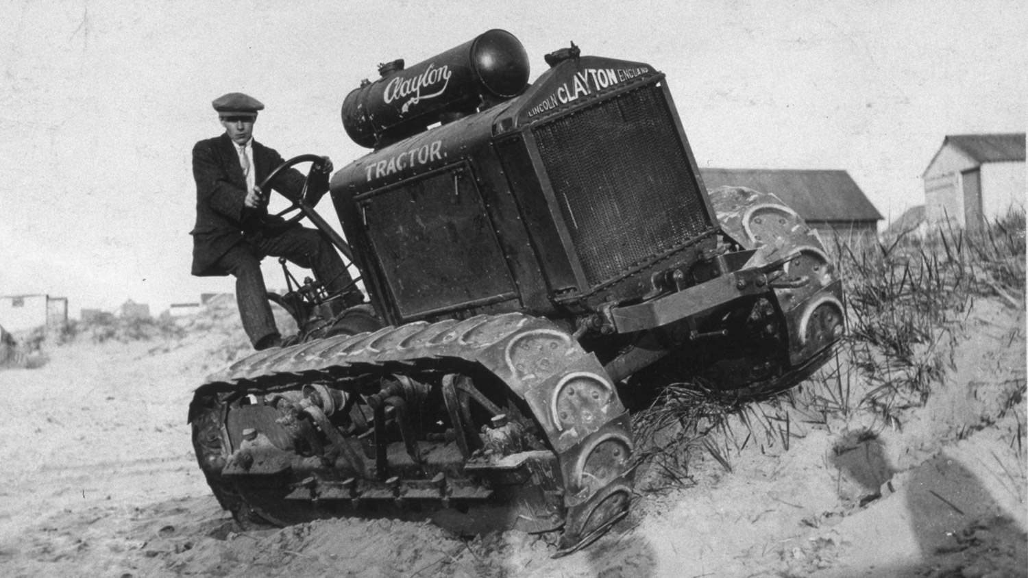 Black and white photo of a tractor with caterpillar tracks