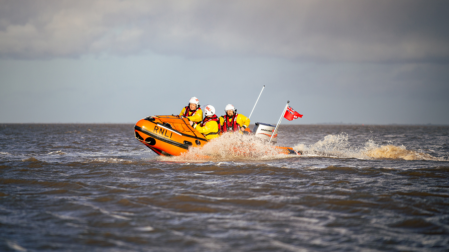 The D class lifeboat from Cleethorpes powers through the waves, with three crew onboard