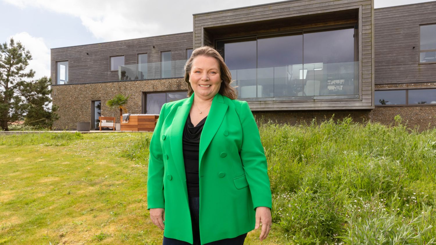 Joanna Scanlan, RNLI supporter, stands outside the Omaze house prize