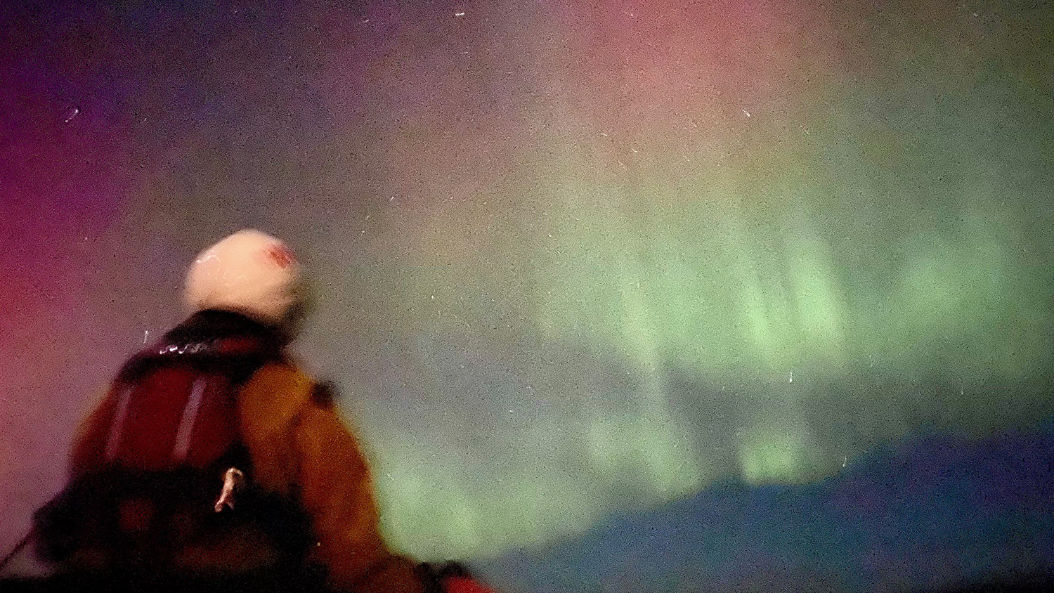 The glowing green and pink of the aurora borealis