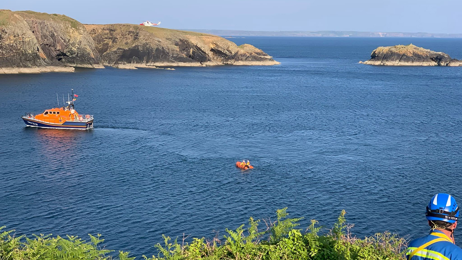 Cowes RNLI’s Tamar class all-weather lifeboat, and its Y boat following behind, in the water at Caerfai Bay