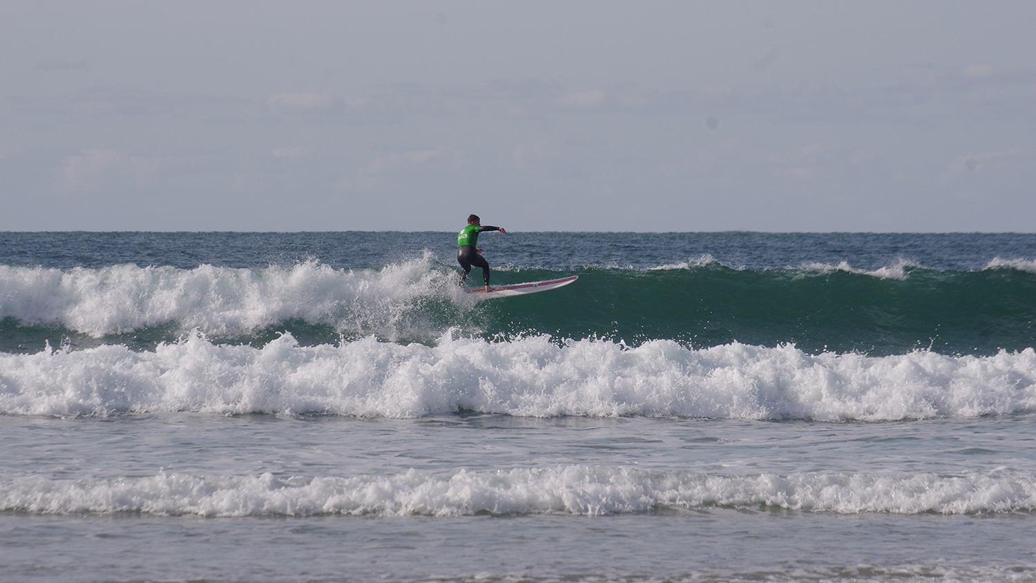 Callum surfing in choppy waters, at a competition in Newquay