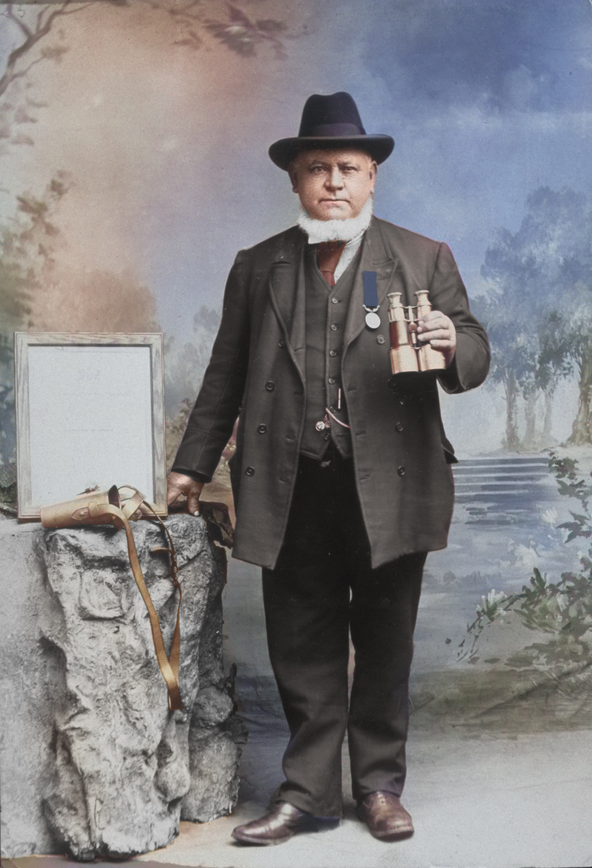 Vintage photo of Blackrock RNLI Coxswain Bernard Hamilton posing with binoculars