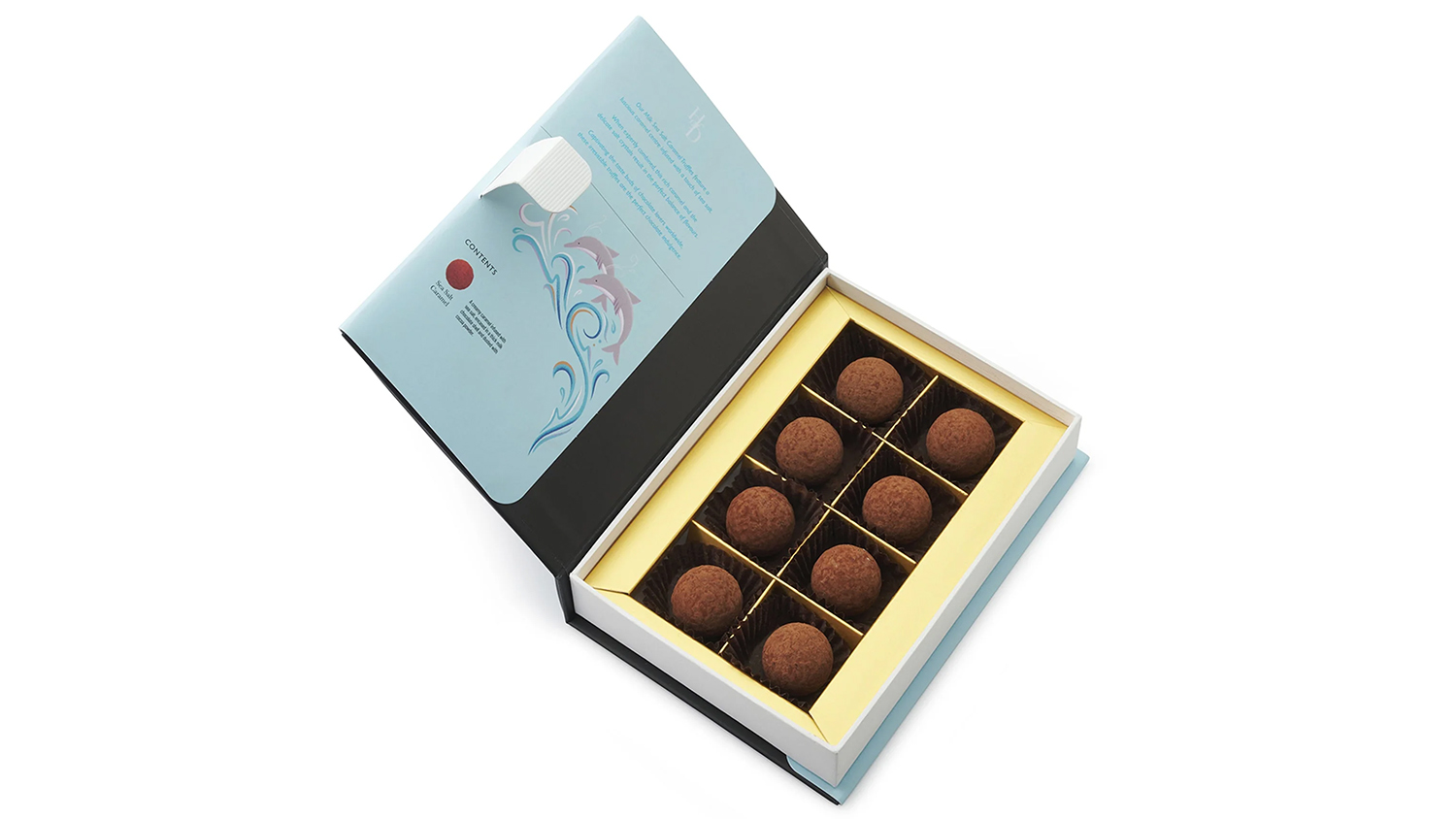 Eight round chocolate truffles, presented in a blue and gold box 