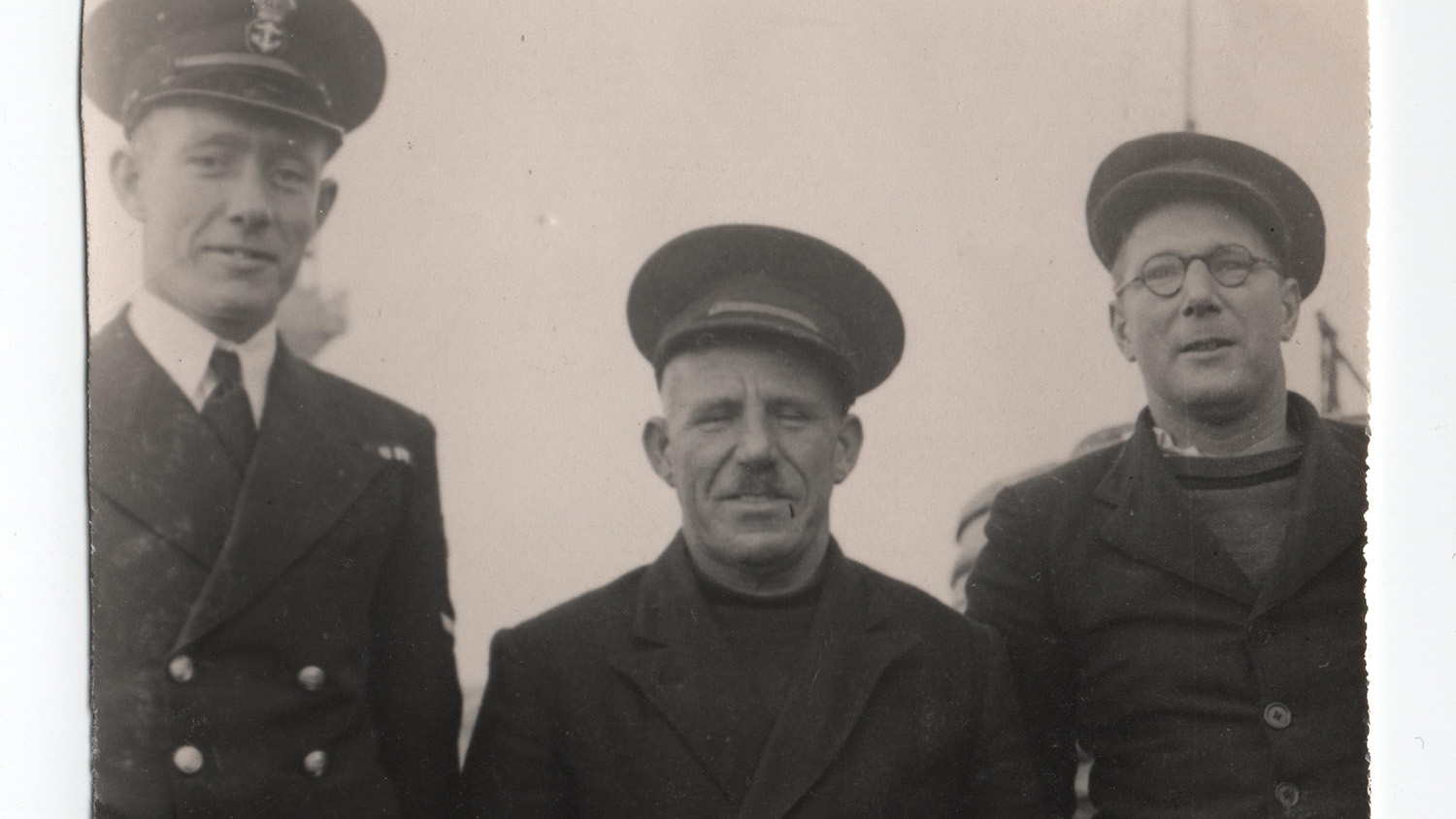 An old black and white image of three men dressed in smart clothes – Jim Parker, Ted Parker and Ted ‘Young Ted’ Parker.