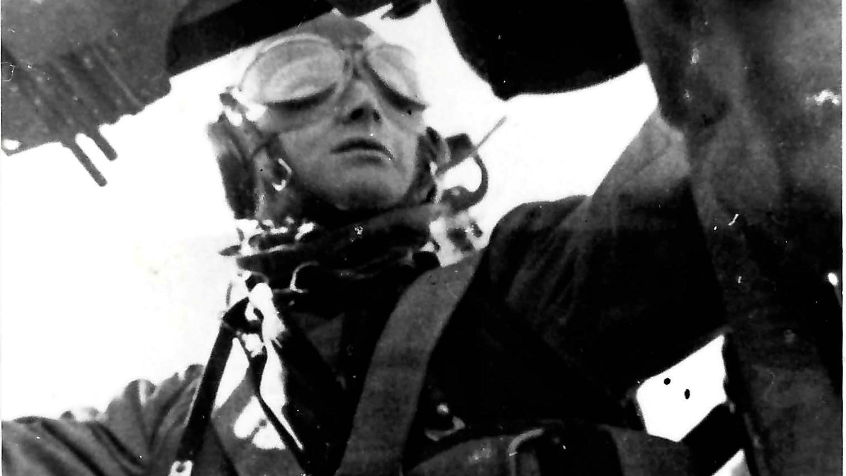 Bernhard in his flying gear inside an aircraft. 