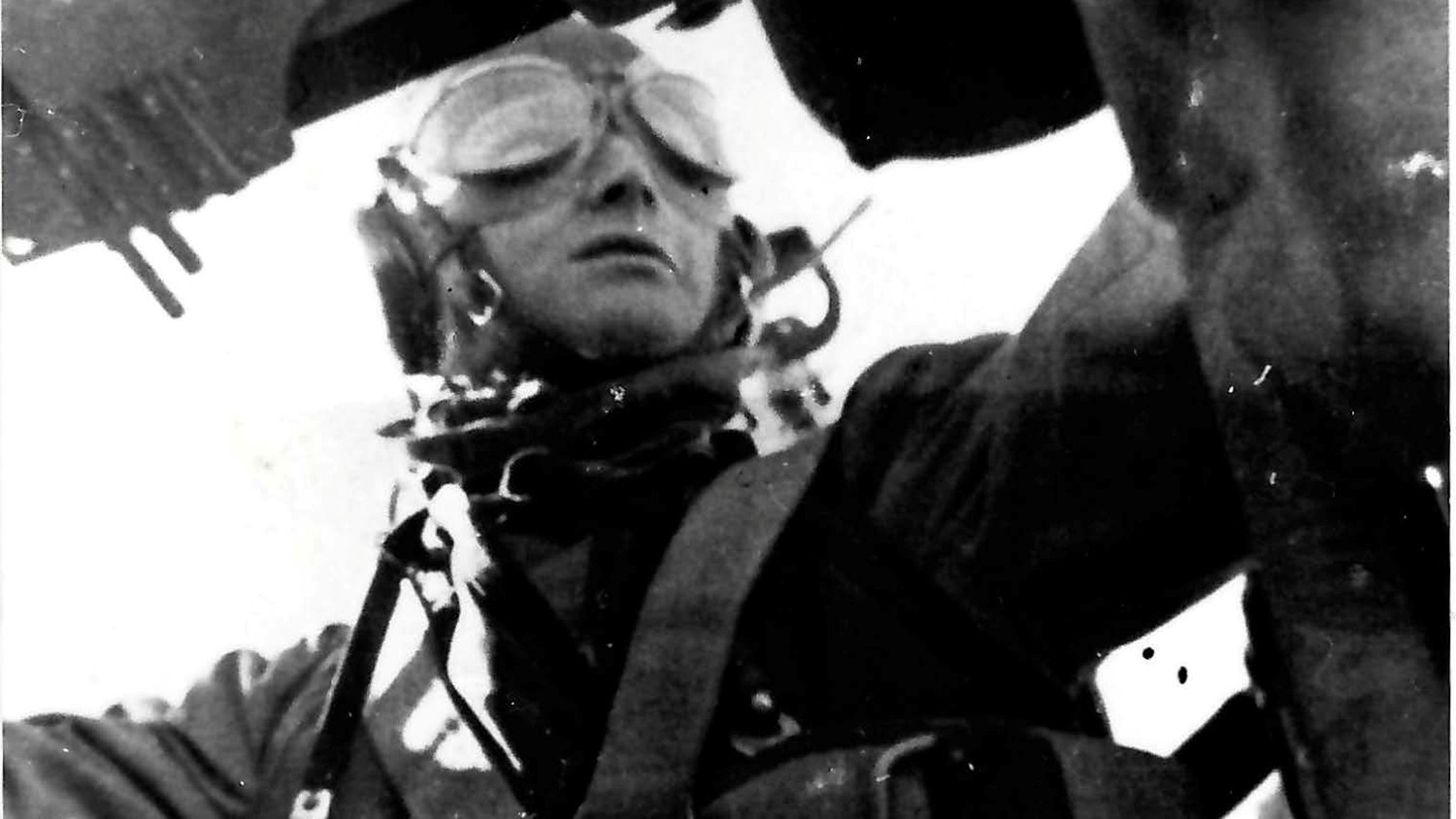 Bernhard in his flying gear inside an aircraft.