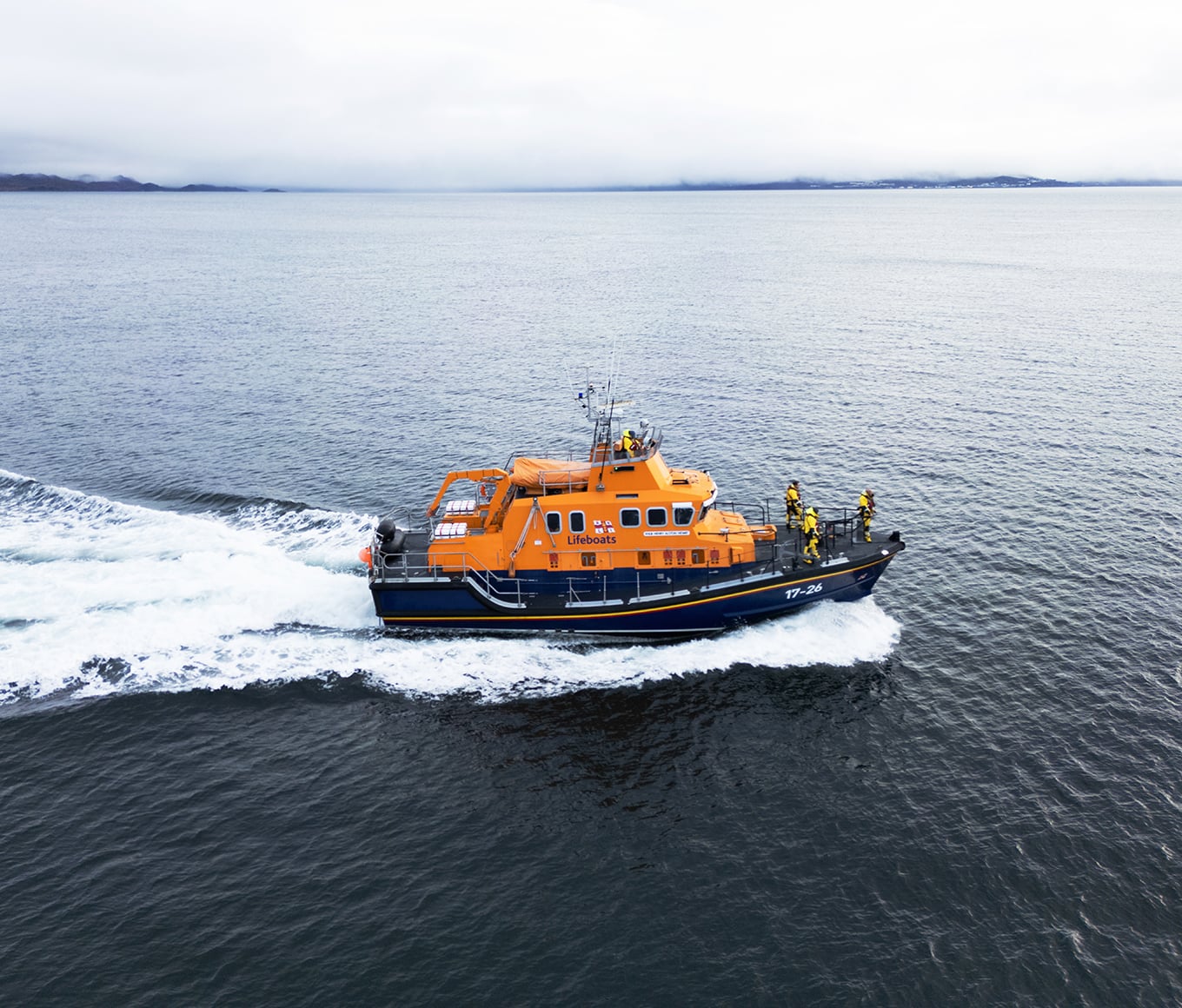 An aerial shot of Mallaig RNLI's Severn class lifeboat in flat, calm seas.