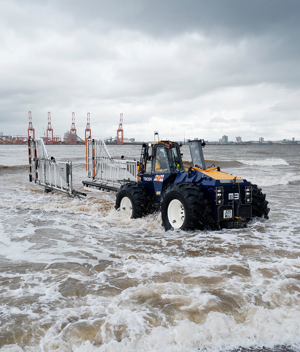 An RNLI tractor at New Brighton launching the Atlantic 85 B class lifeboat with a carriage. 